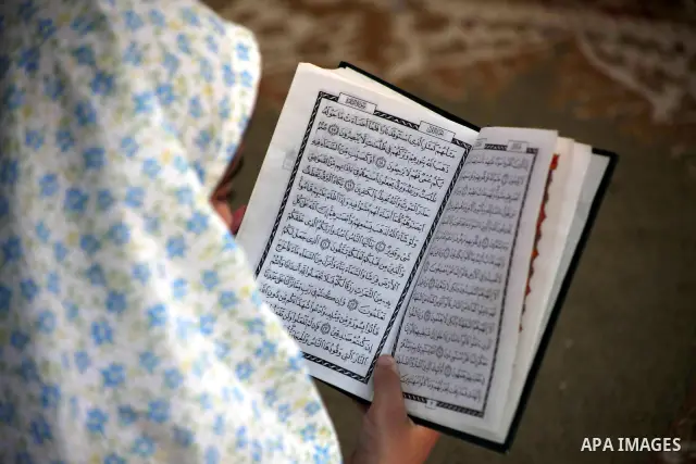 Palestinian girls read the Koran at a summer camp in the Gaza Strip, 04 July 2012. About 20,000 students, both male and female, study under the tuition of 1,200 teachers at the camp. Hamas usually isolates boys and girls...