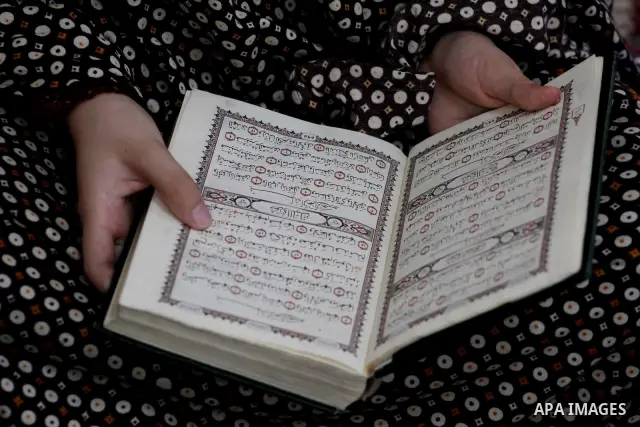 Palestinian girls read the Koran at a summer camp in the Gaza Strip, 04 July 2012. About 20,000 students, both male and female, study under the tuition of 1,200 teachers at the camp. Hamas usually isolates boys and girls...