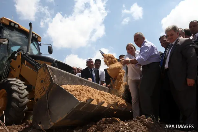 Palestinian Prime Minister Salam Fayyad puts the foundation stone of sanitation regional project in Wad al-Zumar in the West Bank city of Tulkarm on 05 July 2012. Photo by Mustafa Abu Dayeh