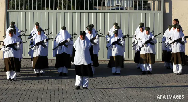 Female Hamas's police officers stand to attention during a ceremony in Gaza City on July 05, 2012. Hamas has governed the Gaza Strip since June 2007, after it won a majority of seats in the Palestinian Parliament in the...