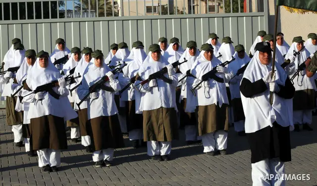 Female Hamas's police officers stand to attention during a ceremony in Gaza City on July 05, 2012. Hamas has governed the Gaza Strip since June 2007, after it won a majority of seats in the Palestinian Parliament in the...