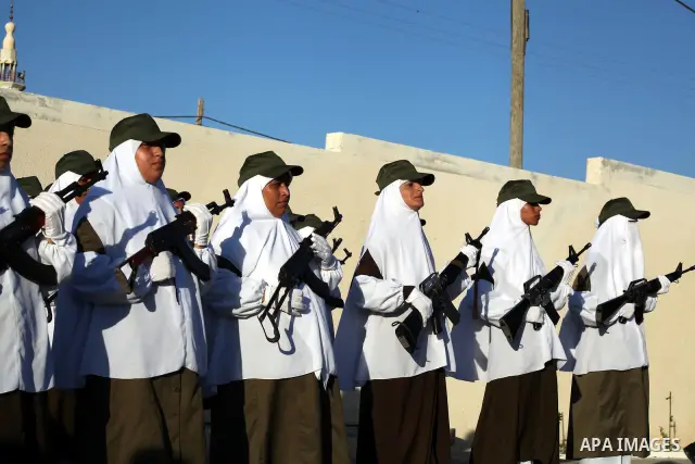 Female Hamas's police officers stand to attention during a ceremony in Gaza City on July 05, 2012. Hamas has governed the Gaza Strip since June 2007, after it won a majority of seats in the Palestinian Parliament in the...