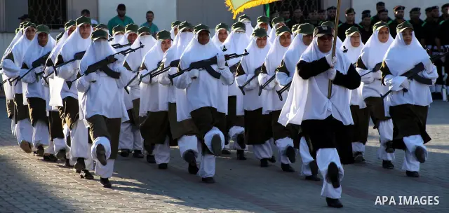 Female Hamas's police officers march during a ceremony in Gaza City on July 05, 2012. Hamas has governed the Gaza Strip since June 2007, after it won a majority of seats in the Palestinian Parliament in the January 2006...