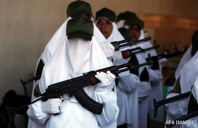 Female Hamas's police officers stand to attention during a ceremony in Gaza City on July 05, 2012. Hamas has governed the Gaza Strip since June 2007, after it won a majority of seats in the Palestinian Parliament in the...
