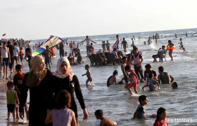 Palestinians enjoy swimming on their week-end in the Mediterranean sea in Gaza City on July 06, 2012. Photo by Ashraf Amra