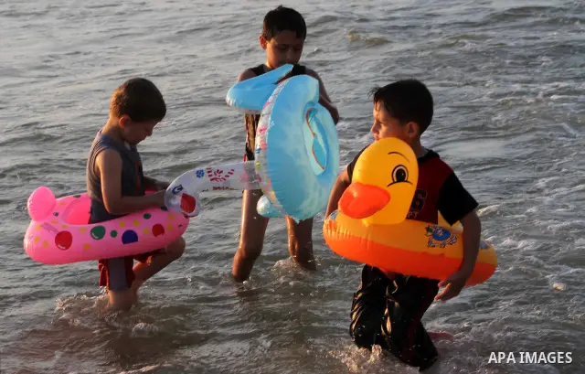 Palestinian children enjoy swimming on their week-end in the Mediterranean sea in Gaza City on July 06, 2012. Photo by Ashraf Amra