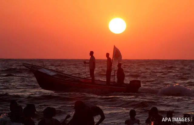 Palestinians ride boat on the beach on their week-end in the Mediterranean port of Gaza on July 06, 2012. Photo by Ashraf Amra