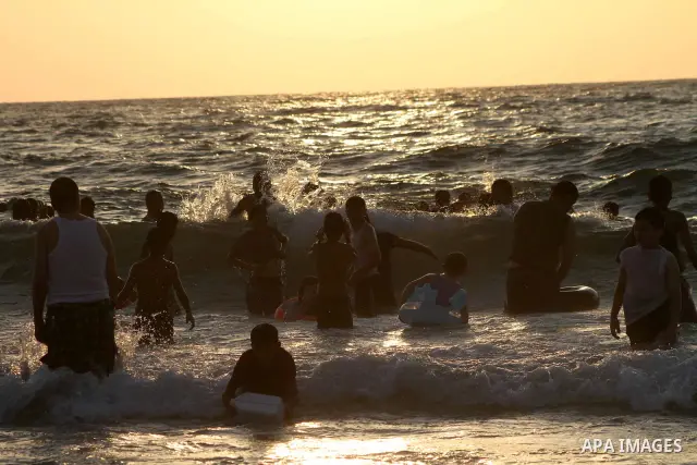 Palestinians enjoy swimming on their week-end in the Mediterranean sea in Gaza City on July 06, 2012. Photo by Ashraf Amra