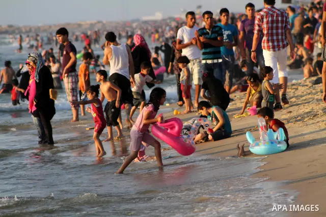 Palestinians enjoy swimming on their week-end in the Mediterranean sea in Gaza City on July 06, 2012. Photo by Ashraf Amra