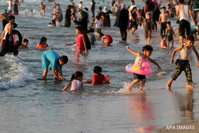 Palestinians enjoy swimming on their week-end in the Mediterranean sea in Gaza City on July 06, 2012. Photo by Ashraf Amra