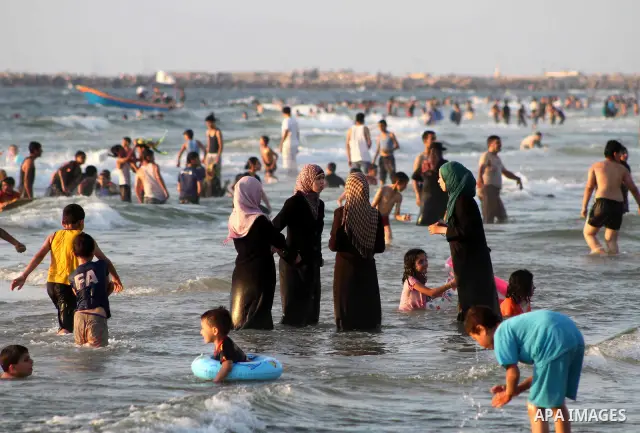 Palestinians enjoy swimming on their week-end in the Mediterranean sea in Gaza City on July 06, 2012. Photo by Ashraf Amra