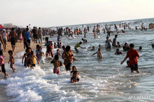 Palestinians enjoy swimming on their week-end in the Mediterranean sea in Gaza City on July 06, 2012. Photo by Ashraf Amra