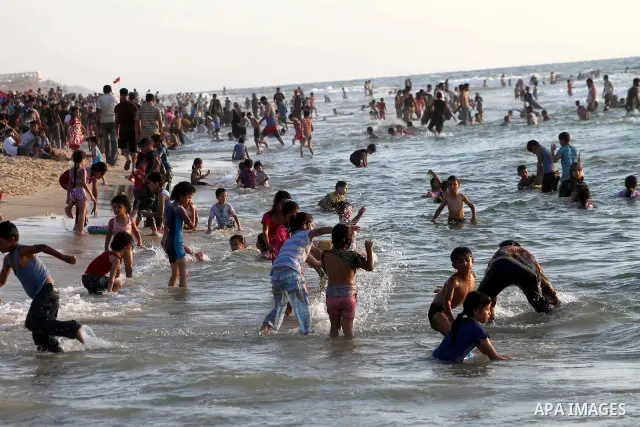 Palestinians enjoy swimming on their week-end in the Mediterranean sea in Gaza City on July 06, 2012. Photo by Ashraf Amra