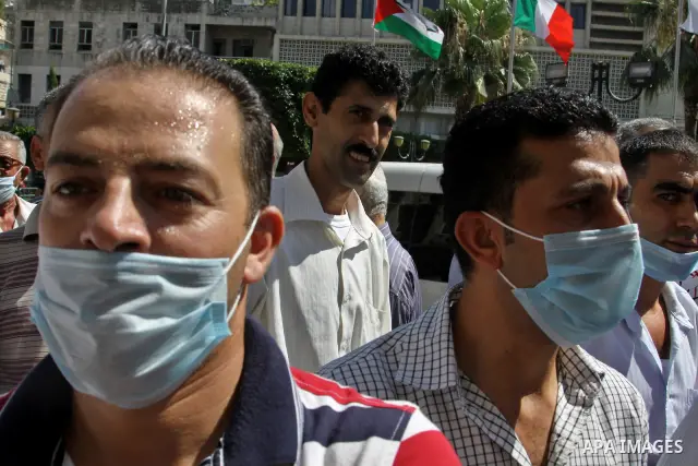 Palestinian demonstrators to calling of the justice and equality and the fight against corrupt during a march in the West Bank city of Nablus in, on July 07.07 2012. Photo by Nedal Eshtayah