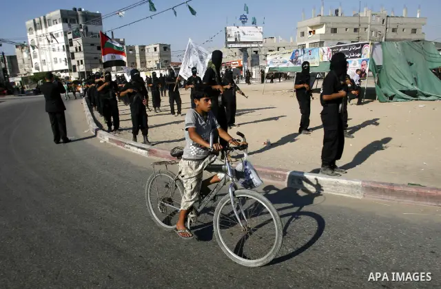 Militants from the Palestinian al-Ahrar Brigade march during a ceremony for the fifth anniversary of their inception in the southern Gaza Strip town of Rafah on July 7, 2012.. Photo by Eyad Al Baba.