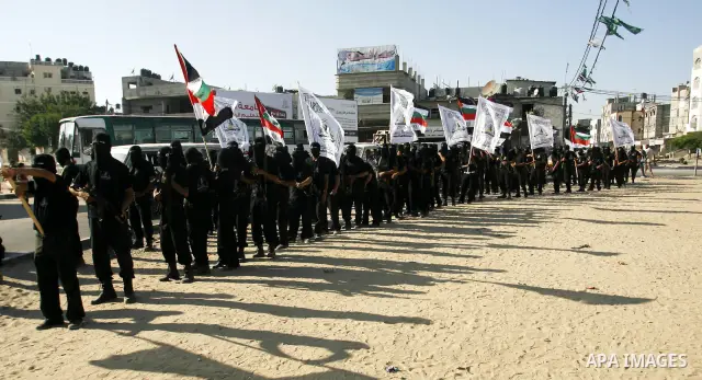 Militants from the Palestinian al-Ahrar Brigade march during a ceremony for the fifth anniversary of their inception in the southern Gaza Strip town of Rafah on July 7, 2012.. Photo by Eyad Al Baba.