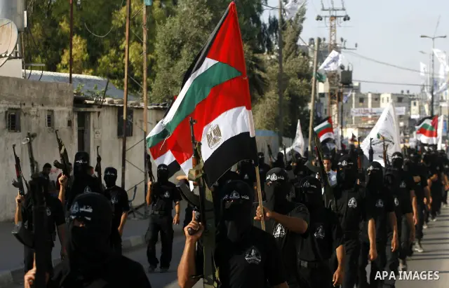 Militants from the Palestinian al-Ahrar Brigade march during a ceremony for the fifth anniversary of their inception in the southern Gaza Strip town of Rafah on July 7, 2012.. Photo by Eyad Al Baba.