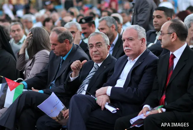 BETHLEHEM, July 8, 2012 Palestinian Prime Minister Salam Fayyad (C) attends a ceremony in front of the Church of the Nativity in the West Bank city of Bethlehem on July 7, 2012. The ceremony is to celebrate the incorpora...