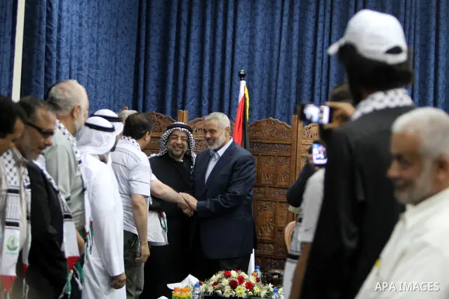 Palestinian Prime Minister in Gaza Ismail Haniyeh meets with the members of "Miles of Smiles 14" aid convoy in his office in Gaza City, on July 08 2012. Photo by Ashraf Amra