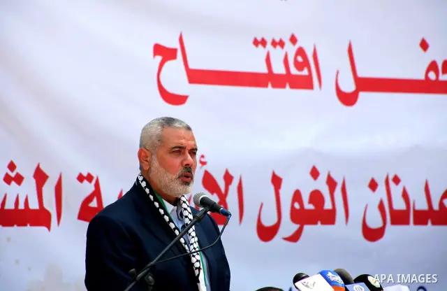 Palestinian Prime Minister in Gaza Ismail Haniyeh speaks during the opening of a new school in Zaytoon neighborhood Gaza city on 08 July 2012. A Palestinian official says Gaza's prime minister will head to Cairo within t...