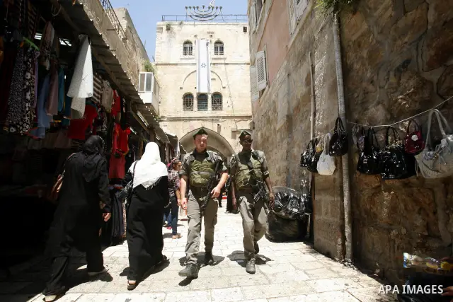 Israeli border police patrol in the Al-Wad Street, in Jerusalem's Old City on July 08, 2012. Photo by Mahfouz Abu Turk. Photo by Mahfouz Abu Turk