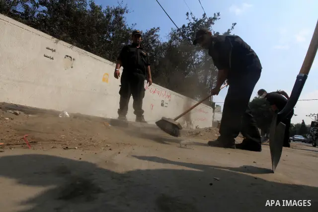 Palestinian officers participate in cleaning streets during a campaign organized by ministry of Labor, in Gaza city on July 09 2012. Photo by Majdi Fathi