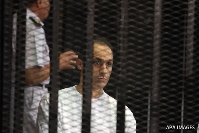 CAIRO, July 9, 2012 Gamal Mubarak, a son of former Egyptian president Hosni Mubarak, is seen behind bars during a trial at the police academy in Cairo, July 9, 2012. Egypt's South Cairo Court on Monday started the trial...