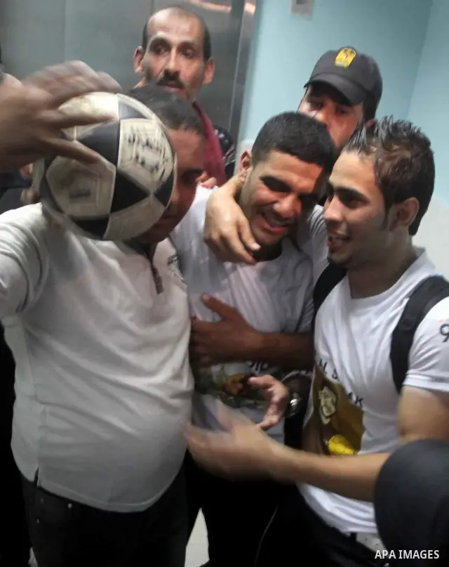 Palestinian soccer player Mahmoud Al-Sarsak waves to people upon his arrival in Gaza City July 10, 2012. Israel released the Gaza soccer player on Tuesday in a deal to end his intermittent four-month hunger strike after...