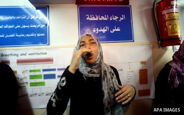 Palestinian woman reacts while Palestinian soccer player Mahmoud Al-Sarsak arrives in Gaza City July 10, 2012. Israel released the Gaza soccer player on Tuesday in a deal to end his intermittent four-month hunger strike...