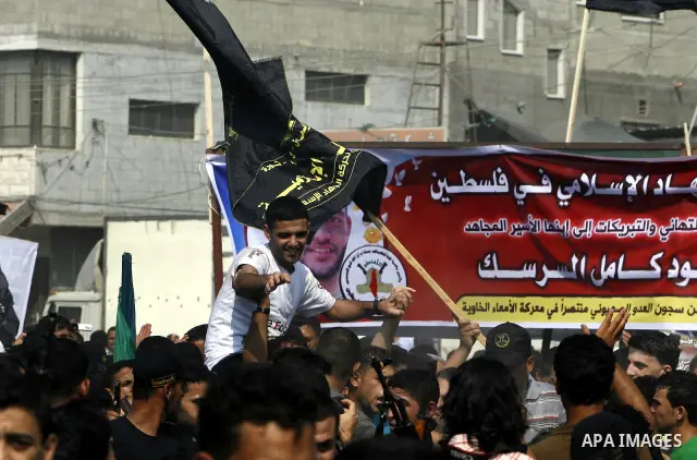 Palestinian soccer player Mahmoud Al-Sarsak greets people upon his arrival to Rafah southern Gaza strip, July 10, 2012. Israel released the Gaza soccer player on Tuesday in a deal to end his intermittent four-month hunge...