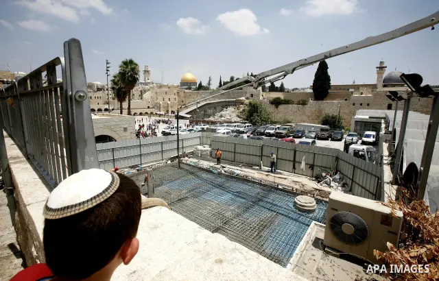 Workers of Israel are seen at an excavation site of an ancient places near al-Aqsa Mosque and Western Wall in order to judaize the area, in Jerusalem's old city, on 10 July 2012. Photo by Mahfouz Abu Turk