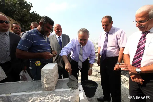 Palestinian Prime Minister Salam Fayyad puts the foundation stone of the city hall of Beit Jala city in the West Bank on 10 July 2012. Photo by Mustafa Abu Dayeh