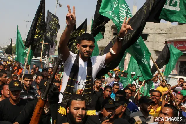 GAZA, July 10, 2012 Palestinian soccer player Mahmoud al-Sarsak flashes the victory sign upon his arrival in the southern Gaza Strip city of Rafah on July 10, 2012. Israel on Tuesday released the Palestinian prisoner who...