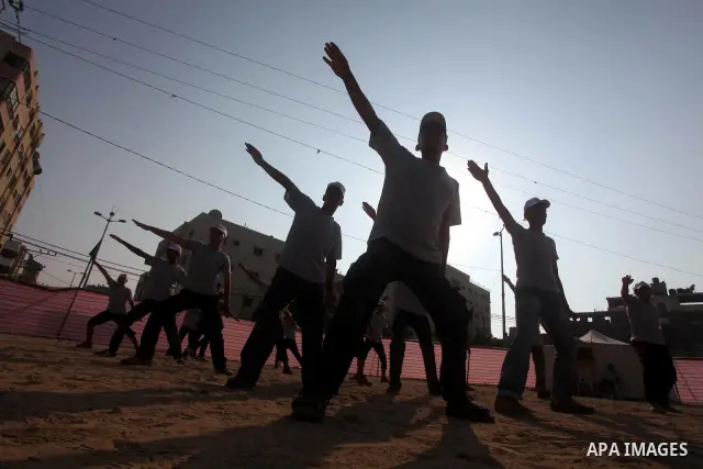 Palestinian children take part in a summer camp organized by Hamas movement at Shati refugee camp in Gaza City July 10, 2012. Hamas movement organized dozens of summer camps for Palestinian children during the period of...