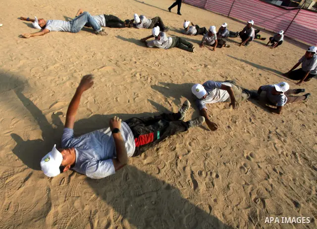 Palestinian children take part in a summer camp organized by Hamas movement at Shati refugee camp in Gaza City July 10, 2012. Hamas movement organized dozens of summer camps for Palestinian children during the period of...