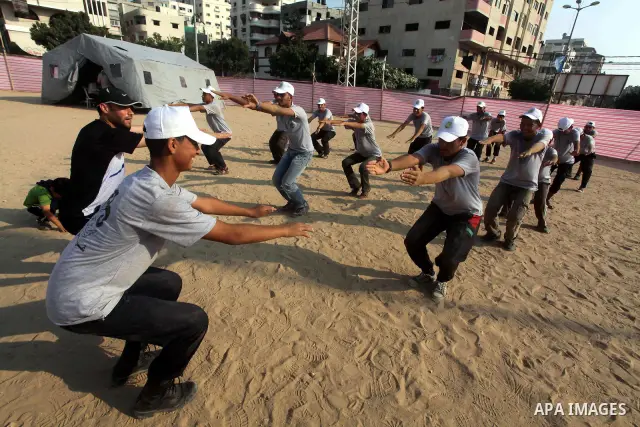 Palestinian children take part in a summer camp organized by Hamas movement at Shati refugee camp in Gaza City July 10, 2012. Hamas movement organized dozens of summer camps for Palestinian children during the period of...
