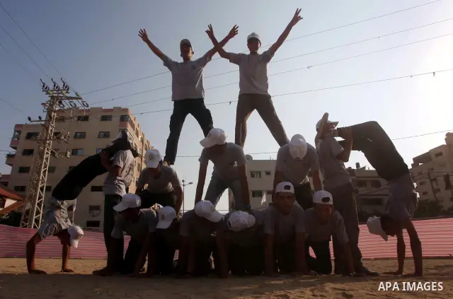 Palestinian children take part in a summer camp organized by Hamas movement at Shati refugee camp in Gaza City July 10, 2012. Hamas movement organized dozens of summer camps for Palestinian children during the period of...