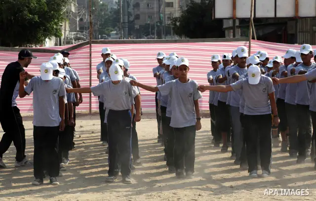 Palestinian children take part in a summer camp organized by Hamas movement at Shati refugee camp in Gaza City July 10, 2012. Hamas movement organized dozens of summer camps for Palestinian children during the period of...