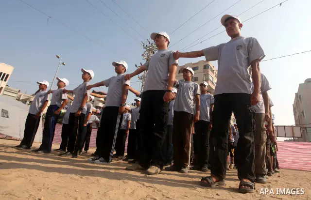 Palestinian children take part in a summer camp organized by Hamas movement at Shati refugee camp in Gaza City July 10, 2012. Hamas movement organized dozens of summer camps for Palestinian children during the period of...