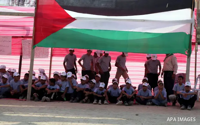 Palestinian children take part in a summer camp organized by Hamas movement at Shati refugee camp in Gaza City July 10, 2012. Hamas movement organized dozens of summer camps for Palestinian children during the period of...