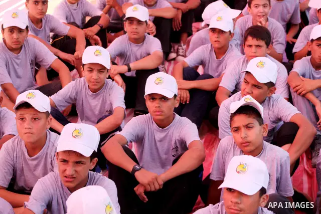Palestinian children take part in a summer camp organized by Hamas movement at Shati refugee camp in Gaza City July 10, 2012. Hamas movement organized dozens of summer camps for Palestinian children during the period of...