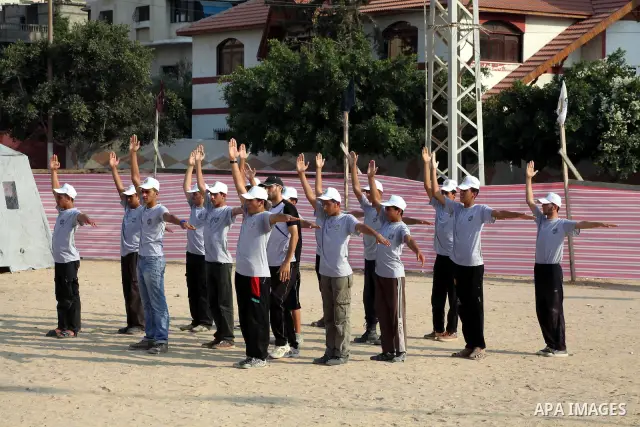 Palestinian children take part in a summer camp organized by Hamas movement at Shati refugee camp in Gaza City July 10, 2012. Hamas movement organized dozens of summer camps for Palestinian children during the period of...