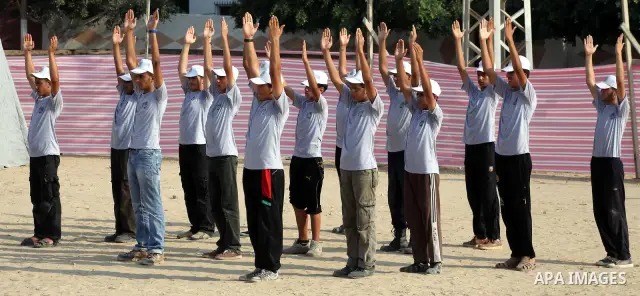 Palestinian children take part in a summer camp organized by Hamas movement at Shati refugee camp in Gaza City July 10, 2012. Hamas movement organized dozens of summer camps for Palestinian children during the period of...