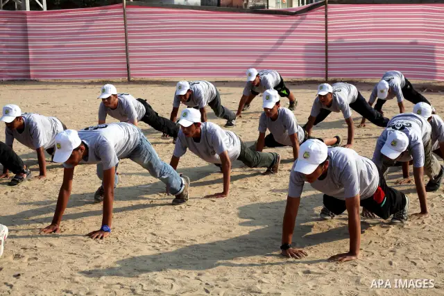 Palestinian children take part in a summer camp organized by Hamas movement at Shati refugee camp in Gaza City July 10, 2012. Hamas movement organized dozens of summer camps for Palestinian children during the period of...
