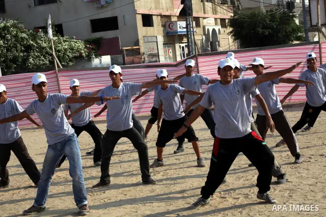 Palestinian children take part in a summer camp organized by Hamas movement at Shati refugee camp in Gaza City July 10, 2012. Hamas movement organized dozens of summer camps for Palestinian children during the period of...