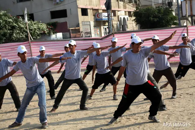 Palestinian children take part in a summer camp organized by Hamas movement at Shati refugee camp in Gaza City July 10, 2012. Hamas movement organized dozens of summer camps for Palestinian children during the period of...