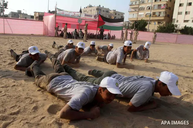 Palestinian children take part in a summer camp organized by Hamas movement at Shati refugee camp in Gaza City July 10, 2012. Hamas movement organized dozens of summer camps for Palestinian children during the period of...