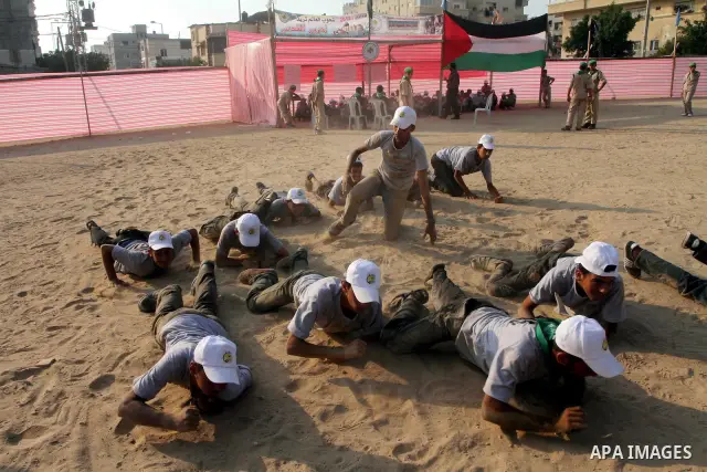 Palestinian children take part in a summer camp organized by Hamas movement at Shati refugee camp in Gaza City July 10, 2012. Hamas movement organized dozens of summer camps for Palestinian children during the period of...