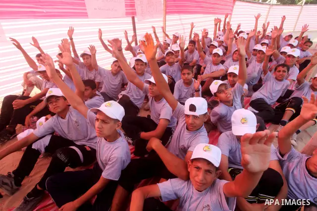 Palestinian children take part in a summer camp organized by Hamas movement at Shati refugee camp in Gaza City July 10, 2012. Hamas movement organized dozens of summer camps for Palestinian children during the period of...