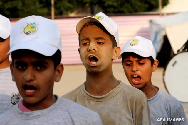 Palestinian children take part in a summer camp organized by Hamas movement at Shati refugee camp in Gaza City July 10, 2012. Hamas movement organized dozens of summer camps for Palestinian children during the period of...